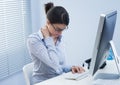Tired businesswoman with neck pain Royalty Free Stock Photo