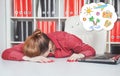 Tired businesswoman sleeping and dreaming about vacation in office Royalty Free Stock Photo