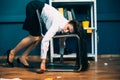 Tired businesswoman sleeping on office chair. Young exhausted pretty girl resting in unnatural pose, falling asleep on Royalty Free Stock Photo