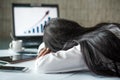 Tired businesswoman sleeping in office