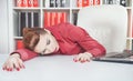 Tired businesswoman sleeping in office Royalty Free Stock Photo