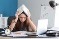 Tired businesswoman trying to meet deadline in office