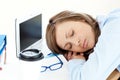 Tired caucasian businesswoman sleeping on her desk Royalty Free Stock Photo