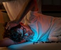 Tired caucasian male having stressed with sleeping pill medication for insomnia treatment Royalty Free Stock Photo