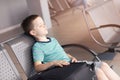 Tired child boy sleeping at the airport Royalty Free Stock Photo