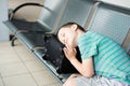 Tired child boy sleeping at the airport Royalty Free Stock Photo