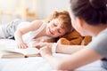 Tired child lying on the bed Royalty Free Stock Photo