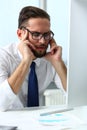 Tired clerk at laptop pc workplace wearing glasses Royalty Free Stock Photo