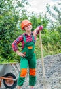 Tired construction work. girl builder takes a shovel of rubble. hardworking youth. game of builder and construction Royalty Free Stock Photo