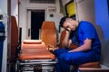 Tired corpsman sleeps inside the ambulance car