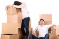 Tired couple with boxes