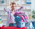 Tired depressed housewife doing laundry Royalty Free Stock Photo