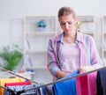 Tired depressed housewife doing laundry Royalty Free Stock Photo