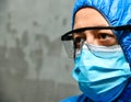 Tired doctor, medical worker wearing a protective suit Royalty Free Stock Photo