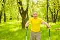 Tired elderly people engaged in Nordic walking