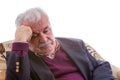 Tired elderly retired man sitting thinking