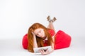Tired exhausted girl lying on bean bag Royalty Free Stock Photo