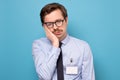 Tired and exhausted guy looking unsatisfied and tired after hard working day Royalty Free Stock Photo