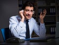 Tired and exhausted helpdesk operator during night shift Royalty Free Stock Photo