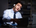 Tired and exhausted helpdesk operator during night shift Royalty Free Stock Photo