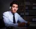 Tired and exhausted helpdesk operator during night shift Royalty Free Stock Photo