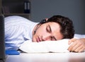 Tired and exhausted helpdesk operator during night shift Royalty Free Stock Photo