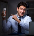 Tired and exhausted helpdesk operator during night shift Royalty Free Stock Photo