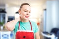 Tired and exhausted housekeeper or maid grabbing scruff Royalty Free Stock Photo