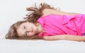 Tired exhausted lazy little girl kid lying on sofa Royalty Free Stock Photo