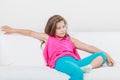 Tired exhausted lazy little girl kid lying on sofa Royalty Free Stock Photo