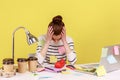 Tired exhausted overworked woman office worker covered with sticky notes, clasping head. Royalty Free Stock Photo