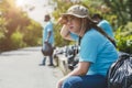 Tired exhausted volunteer people hard working cleaning garbage waste for help clean the world