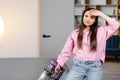 Tired and exhausted woman vacuuming house, cleaning rug carpet in living room, frustrated with doing much work about the house Royalty Free Stock Photo