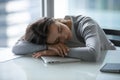 Tired exhausted young businesswoman falling asleep at work desk Royalty Free Stock Photo