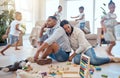 Tired, family and children running in living room with toys and playing for energy, noise and active. Burnout, headache Royalty Free Stock Photo