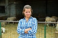 Tired worker stands near the corral