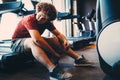 Tired fat man thinking over weight problems, desire to lose weight, gym workout Royalty Free Stock Photo