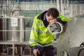 Tired fatigue exhaustion engineer worker hard working in factory. worker sick from Corona virus flu Royalty Free Stock Photo