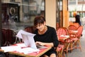 tired female employee of bank adds financial plan in laptop