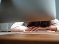 Tired female employee at office workplace taking nap Royalty Free Stock Photo