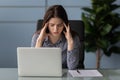 Tired female employee suffer from strong migraine at workplace Royalty Free Stock Photo