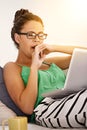 Tired, female person and yawn on sofa laptop or working, sleepy and exhausted in living room. Woman, casual outfit or Royalty Free Stock Photo