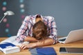 Tired female student learning till late at home Royalty Free Stock Photo