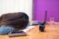 Tired female student sleep on book Royalty Free Stock Photo