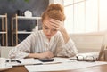 Tired financier woman working at office desktop