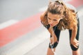 Tired fitness woman outdoors in the city