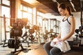 Tired fitness woman resting after morning training in gym. Royalty Free Stock Photo