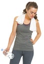 Tired fitness young woman with towel and bottle of water Royalty Free Stock Photo
