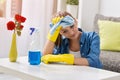 Tired frustrated and exhausted woman cleaning home