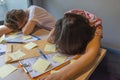 Tired and frustrated office women sleeping in office